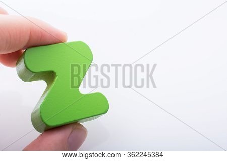 Hand Holding Letter Cube Z Of Made Of Wood