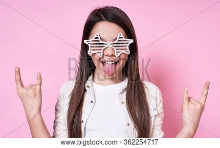 Young Brunette Caucasian Child Over Isolated Background Shouting With Crazy Expression Making A Rock