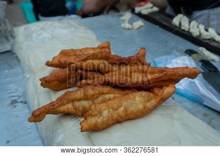 Bread Fry, A Chinese Breakfast, Being Prepared In The Morning On The Street For Sale At Territy Baza