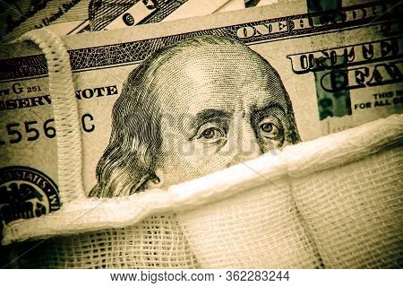 A Hundred-dollar Bill With A Medical Mask .the Concept Of Coronavrius Epidemic