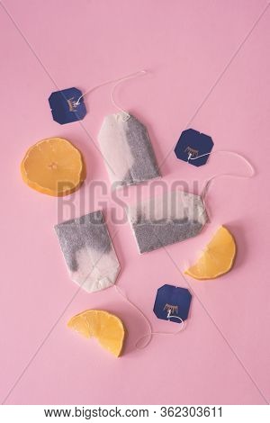 Three Bags Of Black Tea With Lemon Slices On A Pink Background. Fresh Tea, Tea Party. The View From 