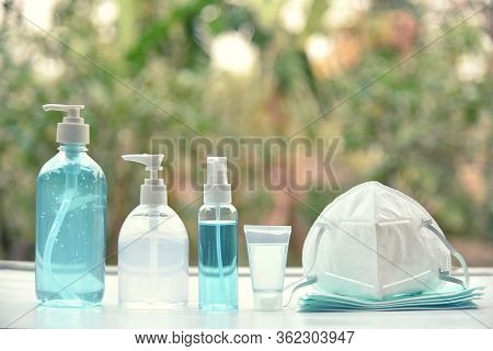 Hand Sanitizer Gel Alcohol And Medical Masks. Concept Coronavirus Pandemic Prevention Or Covid-19