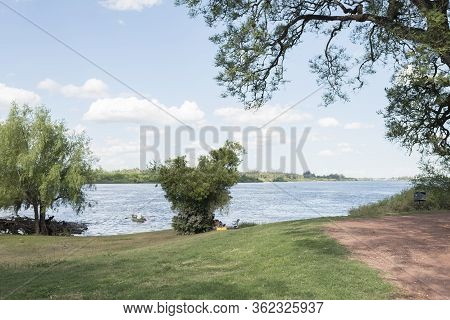 Mercedes, Soriano / Uruguay; Dec 26, 2018: Summer Landscape On The Bank Of The Rio Negro: Grass With