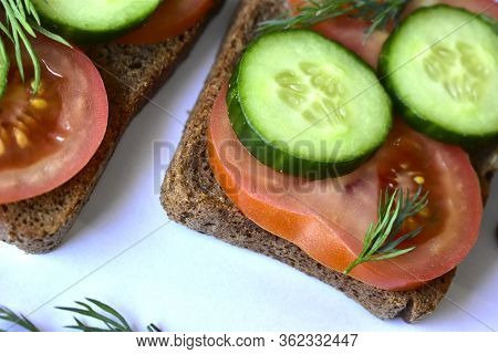 Several Diet Sandwiches With Cucumber And Tomato From Black Bread