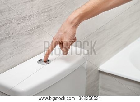 Male Hand Flushing Toilet Bowl With Button