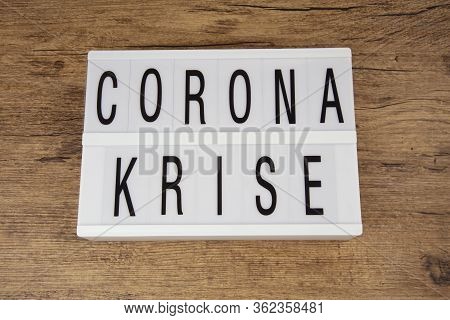 Concept: Corona Krise  In German Language Over Wooden Background Means Corona Crisis