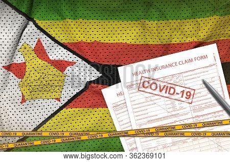 Zimbabwe Flag And Health Insurance Claim Form With Covid-19 Stamp. Coronavirus Or 2019-ncov Virus Co