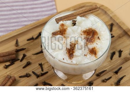 Bowl Of Hominy (canjica) On A Wooden Tray, Typical Brazilian Food At The June Festivals