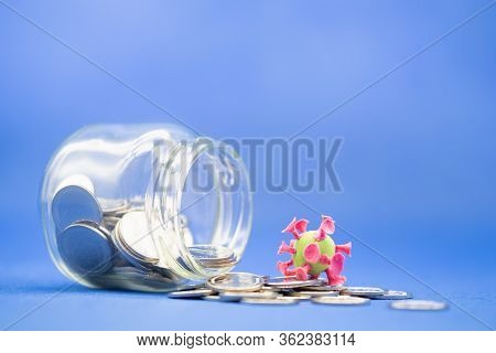 Business, Money, Finance And Saving Concept. Closeup Of Coins In Glass Jar Container And Mini Ball C
