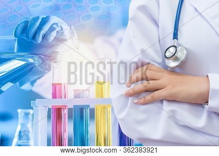 Doctor And Microbiologist With Vacuum Tubes For Samples With Covid 19 Infection Atypical Pneumonia V