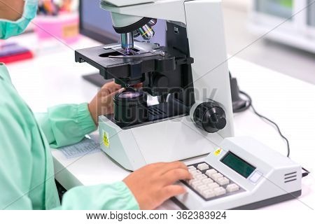 Doctor Or Scientist And Microbiologist With Equipment Science Experiments Vacuum Tubes For Samples W