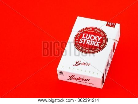 MOSCOW, RUSSIA - APRIL 21, 2020: Lucky strike cigarette box on a carcass background. Illustrative editorial image
