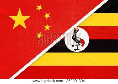 China Or Prc Vs Uganda National Flag From Textile. Relationship Between Asian And African Countries.