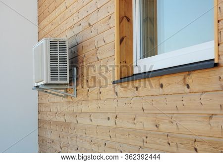 House Exterior Knotty Pine, Ceder Wood Wall Siding And Panel With Air Conditioner Outdoor Unit And W