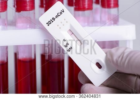 Rapid Covid-19 Coronavirus Strip Test Cassette For Antibody Or Sars-cov-2 Virus Disease In Hand And