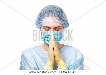 A Young Doctor In Medical Dress Clasped Her Hands In Prayer. It Asks To Save The World, The Planet, 