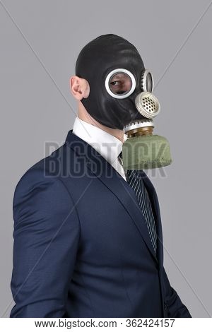 Close Up Portrait Of Man In A Protective Gas Mask With Flower