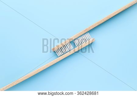 Zero Waste And Without Plastic Concept. Two Eco Friendly Bamboo Toothbrushes On A Light Blue Surface
