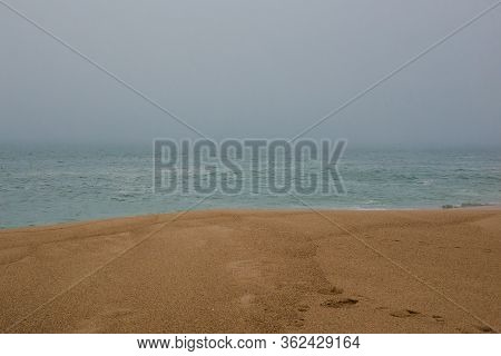 Sea And Sandy Beach In Dense Fog, Autumn Day