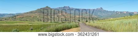 A Panoramic View Of The Amphitheatre In The Drakensberg With Bonjaneni Township In The Front. Dooley