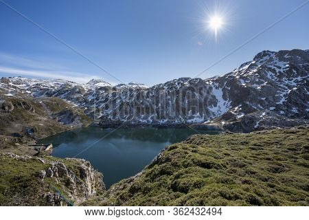 Calabazosa Lake At The End Of Winter With Snowy Areas In The Mountains. Saliencia Lakes In The Somie