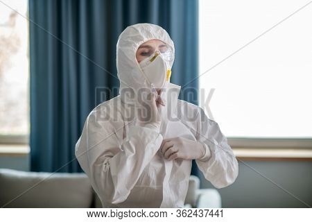 Woman In White Workwear Wearing Protective Mask