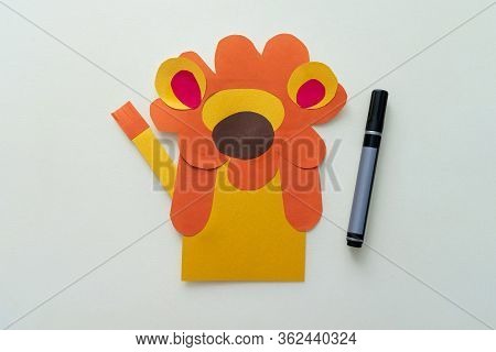 A Child Makes A Lion From Paper And Cardboard. Master Class, Diy, Animals Of Africa, Yellow Color. H