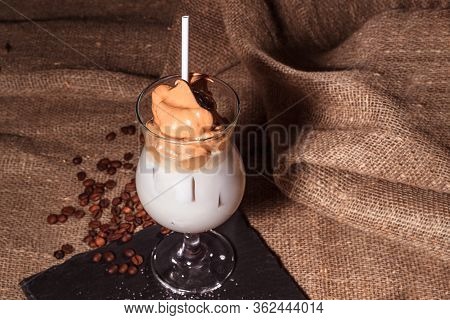 Cold Trendy Drink Korean Dalgon Iced Coffee On A Dark Background. Delicious And Popular Coffee In Th