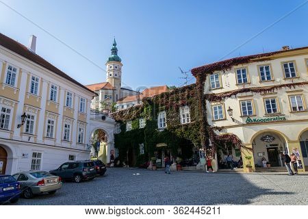 Mikulov, Czech Republic - October 13 2019: People Walk On Streets With Mikulov Castle In Background