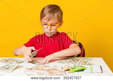 Money For Future Education. Cute Boy Acount His Money. Financial Literacy Of Children.