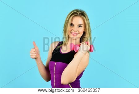 Be Successful. Girl Use Barbell Blue Background. Slim Girl Doing Triceps Exercise With Dumbbell In T
