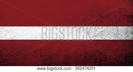 The Republic Of Latvia National Flag. Grunge Background