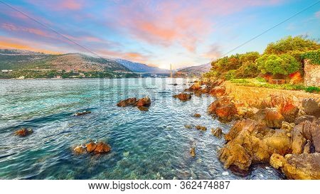 Panorama Of Impressive Franjo Tudjman Bridge At Sunset And Rocky Shore Of Dubrovnik. Location:  Dubr