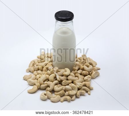 Cashew Nut Milk In Bottle On Isolated Background. Healthy Food For Protine From Nuts.