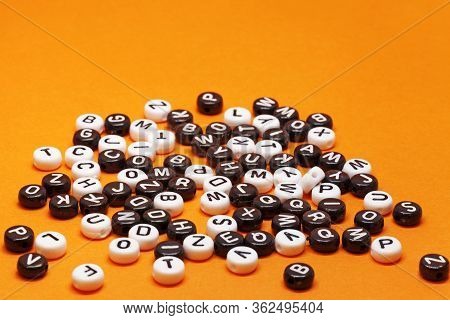 Beads With Letters On Orange Background At My Studio