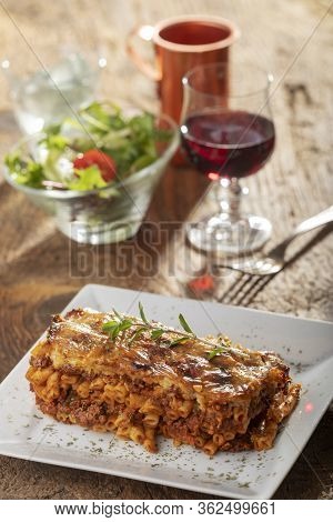 Greek Pastizio Noodle Dish With Cheese On Wood