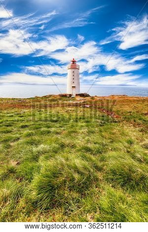 Stunning View Of Skarsviti Lighthouse In Vatnsnes Peninsula On A Clear Day In North Iceland. Locatio