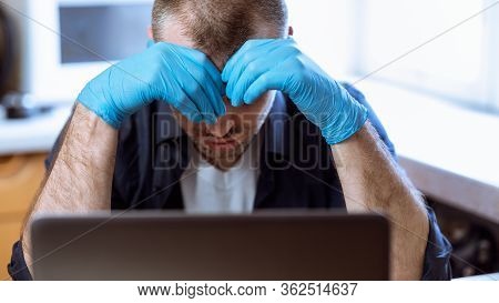 Coronacrisis And Bankruptcy. Depressed Man Sitting At Laptop After Business Fail At Home. Selective 