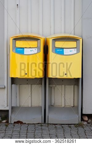Mariefred, Sweden - March 22, 2020: Two Yellow Letterboxes Operated By The Swedish Postal Service Po
