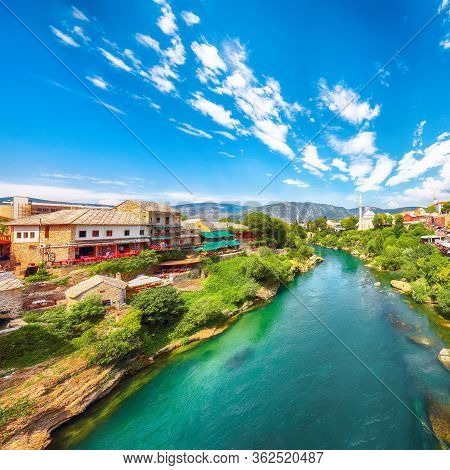 Nerteva River And Old City Of Mostar, With Ottoman Mosque  During Sunny Day. Location: Mostar, Old T