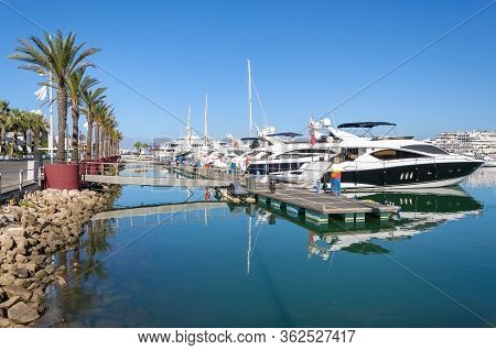 Luxury Yachts Moored In The Port Of Vilamoura At The Hotel Building, Algarve, Portugal