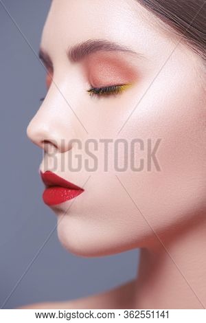 Make-up and beauty concept. Close-up portrait of a beautiful girl with fresh healthy shining skin. Facial skin care, cosmetology.