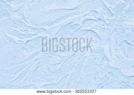 A Relief Blue Wall Is Finished With Decorative Plaster. Design Background On The Theme Of Renovation