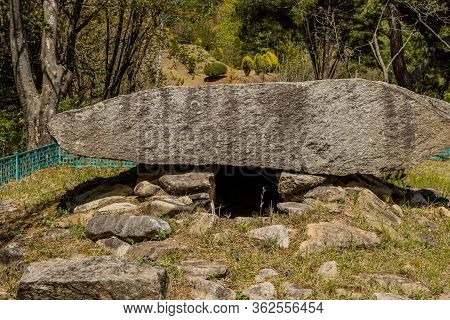 Large Boulder Covering Opening To Burial Camber In Public Park,