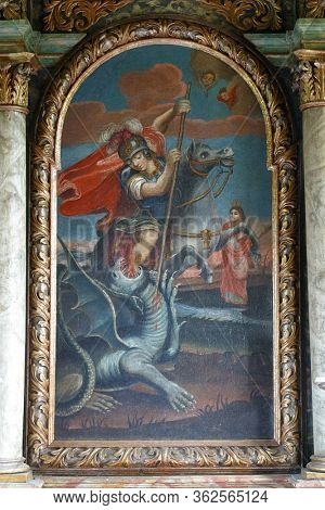 LIJEVI STEFANKI, CROATIA - JULY 10, 2011: Saint George slaying the dragon, the altarpiece in the chapel of St. George in the Lijevi Stefanki, Croatia 