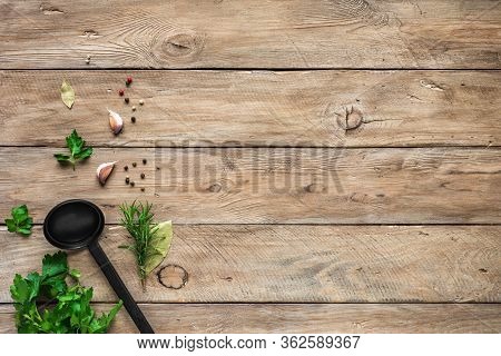 Herbs And Spices With Cooking Spoon (ladle) On Wooden Background. Cooking And Healthy Eating Concept