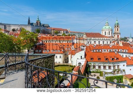 Prague Castle And St Nicholas Church In Lesser Town Of Prague. Sunny Spring Day View From Vrtba Gard