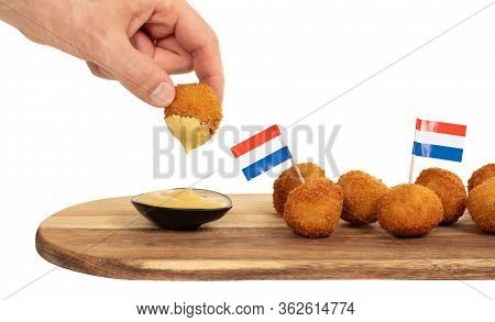 Dutch Traditional Snack Bitterbal In A Hand, Isolated