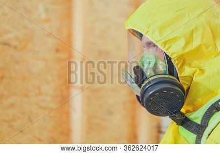 Close Up Of Man In Hazmat Suit And Mask Inside Of New Building Constrcution