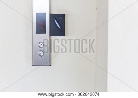 Securing Lift Or Elevator Access Control. Elevator Access Control, Hand Holding A Key Card To Unlock